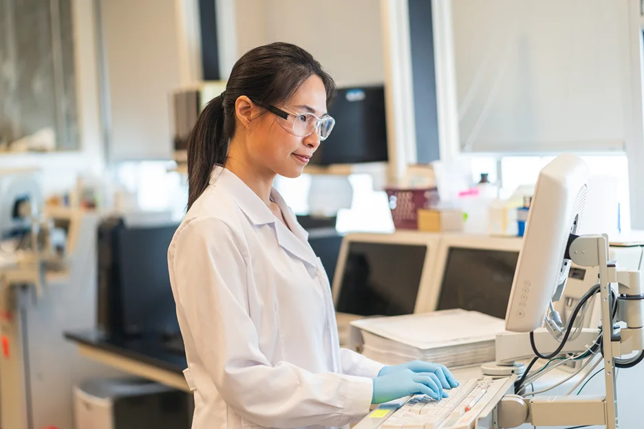 researcher conducts ongoing clinical trials