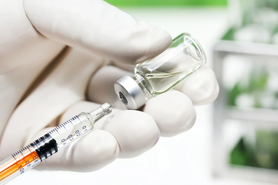 a syringe and a vial of pdrn booster